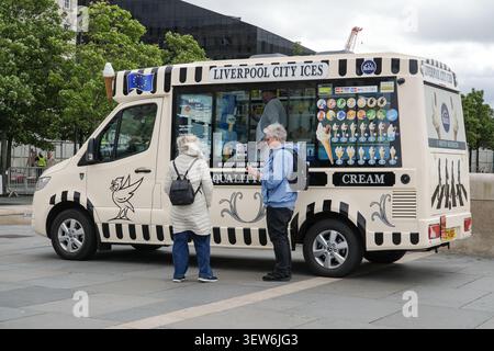 Customers ordering ice cream from a Liverpool City Ices van in Liverpool, UK. Stock Photo