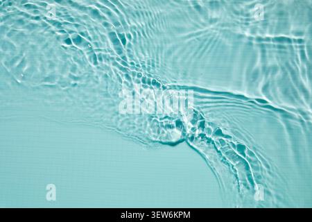 Blue swimming pool water creating ripples and wave patterns Stock Photo