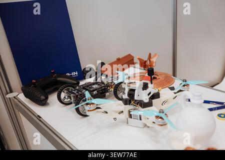 Osijek Croatia - 15 05 2026 At Osijek Drone Expo on May 15, 2026, many drone models are displayed on a table. Devices and accessories are present, sho Stock Photo