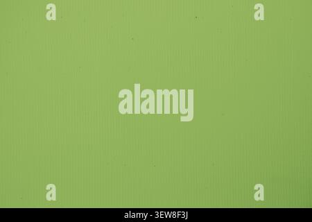 High resolution lime green textured background with abstract geometric linear pattern. Minimalist vibrant backdrop with fine vertical corrugated lines Stock Photo