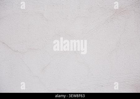 High-resolution background image of a light gray, beige, or cream plaster wall surface. Minimalistic abstract concrete background with subtle structur Stock Photo