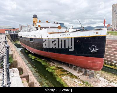 The preserved historic tender ship SS Nomadic docked at the Hamilton Graving Dock in the Titanic Quarter, Belfast, Northern Ireland. Stock Photo