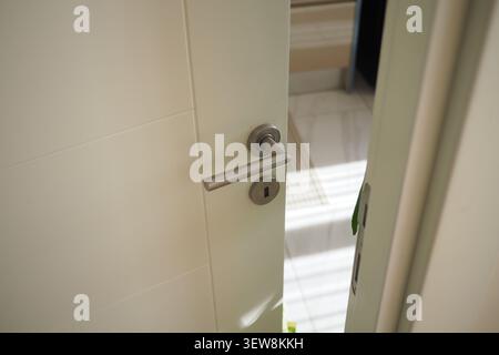 Close view of a door handle in a bright room Stock Photo