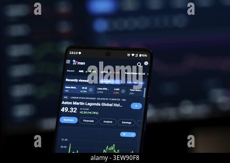 Phone screen displaying Aston Martin stock data on finance app Stock Photo