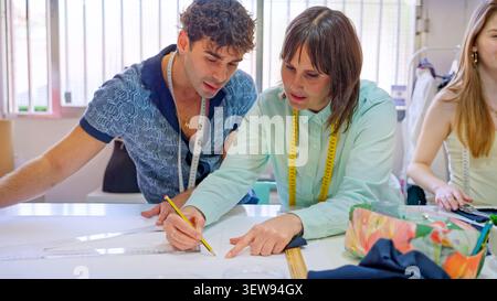 Fashion students learning pattern making in workshop Stock Photo
