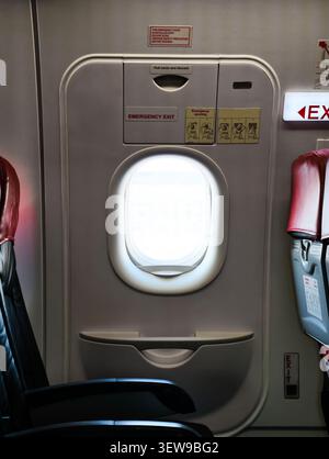 emergency exit door on an airplane Stock Photo