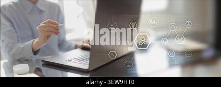 Robotic process automation system for enterprise workflow efficiency with human interaction on laptop Stock Photo