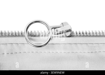 White cotton fabric unzipped slider closeup isolated on white background Stock Photo