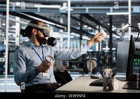 Data center programmer uses a VR headset to inspect AI neural networks and server systems in a high-tech facility. Stock Photo