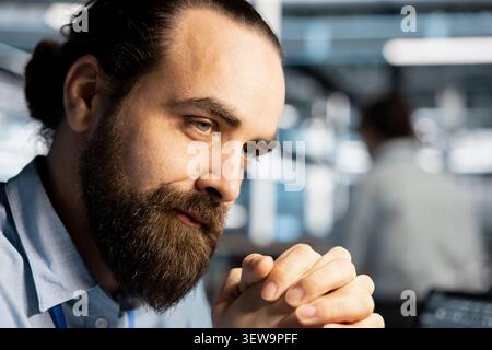 Data center engineer inspects server infrastructure, performs maintenance checks and reviews equipment diagnostics. Stock Photo