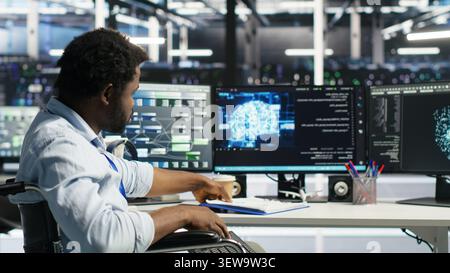 Data center admin in a wheelchair receives paperwork from a colleague while using AI node tree software. Stock Photo