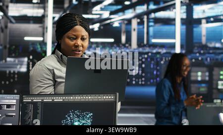 Frustrated data center worker reacts to malfunctioning node tree software and technical errors during AI analysis. Stock Photo