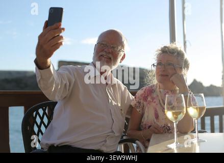 Happy senior couple taking a selfie on a date Stock Photo