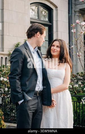 Young romantic couple gazing at each other lovingly Stock Photo