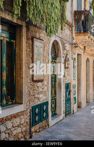 Colorful decorated doors on an old sicilian street in Taormina Stock Photo