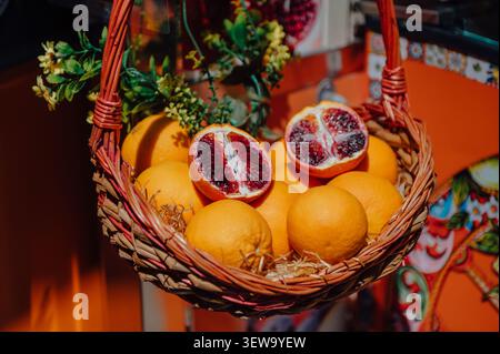 Fresh cut blood oranges in a wicker basket Stock Photo
