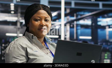 Data center engineer uses node tree AI software to analyze infrastructure and identify issues in a data center. Stock Photo