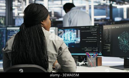 System administrator uses neural network node tree software to analyze infrastructure in a data center. Stock Photo