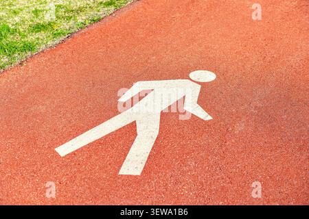 Pedestrian Sign / Road signs - painted sign on asphalt for pedestrian lane Stock Photo