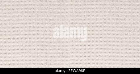 Light gray fabric showing a textured surface with repeating dots pattern Stock Photo