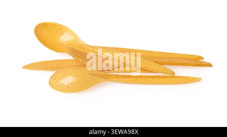 Yellow disposable fork, knife, and spoon placed on a transparent background Stock Photo