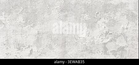 Grungy white concrete plastered wall texture creating abstract background Stock Photo