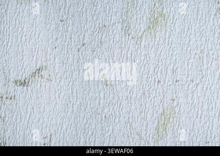 White handmade paper featuring a fine rippled surface and faint embedded botanical fibers, creating a soft organic background for design projects. Stock Photo