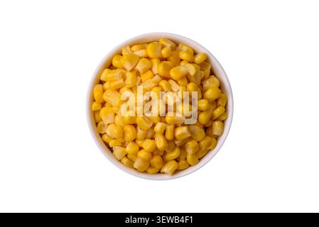 Golden, sweet canned corn kernels or maize for salads and vegetarian dishes. Canned corn as a food background for your design Stock Photo