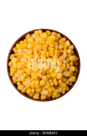 Golden, sweet canned corn kernels or maize for salads and vegetarian dishes. Canned corn as a food background for your design Stock Photo