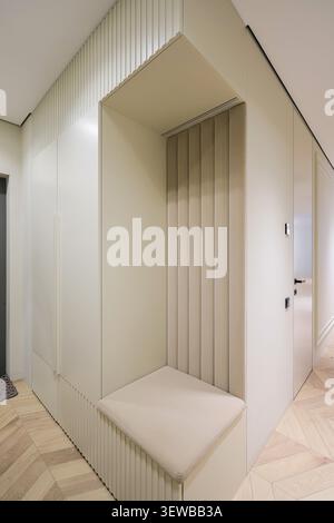 Hallway wardrobe with soft bench seat Stock Photo