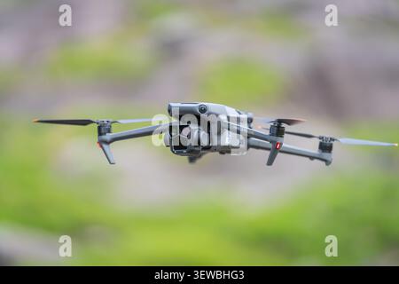 Drone hovering in flight, DJI Mavic 3 Pro Cine capturing aerial imagery. Stock Photo