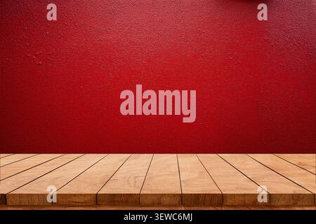 Empty wooden tabletop against a pink and red wall background. Vibrant studio mockup for product display and promotional advertising. Stock Photo
