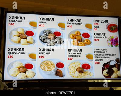 Khimki, Russia - June 25, 2026: Menu display featuring various traditional Georgian dishes including khinkali, soup, and salad with prices listed Stock Photo