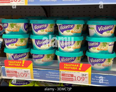 Khimki, Russia - June 25, 2026: Violette brand dairy products displayed on supermarket shelf with promotional pricing labels in a grocery store Stock Photo