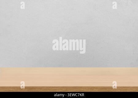 Empty wooden tabletop against a dark gray wall background. Minimalist studio mockup for product display and promotional advertising. Stock Photo