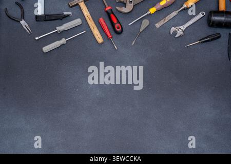 Assortment of Hand Tools on Dark Background copy space top view Stock Photo