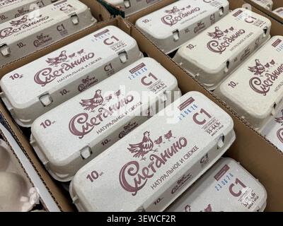 Khimki, Russia - June 25, 2026: Egg cartons labeled with brand stacked in cardboard boxes, natural and fresh product packaging Stock Photo