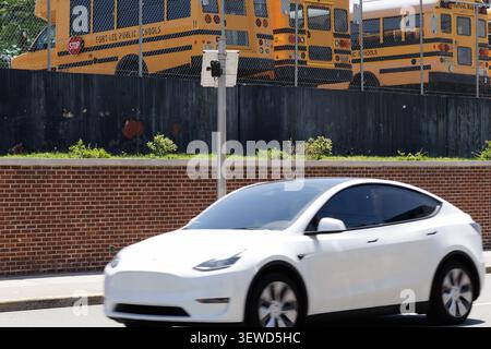 Fort Lee, NJ, USA - May 17, 2026: Flock Safety AI license plate reader camera positioned near Fort Lee Public Schools bus depot, New Jersey. Stock Photo