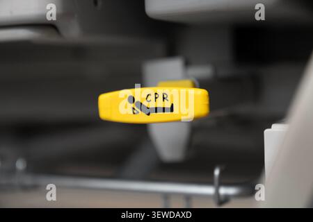 Hospital bed CPR release lever in a modern medical facility. Essential safety feature for emergency care and rapid life support response. Stock Photo