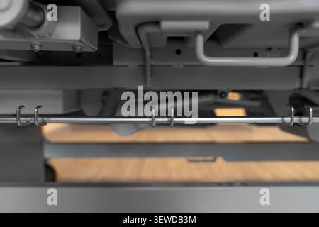 Hospital bed CPR release lever in a modern medical facility. Essential safety feature for emergency care and rapid life support response. Stock Photo
