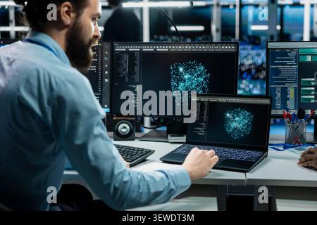 System administrator uses an AI language model assistant in a server hub to handle infrastructure maintenance. Stock Photo