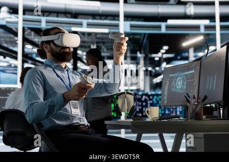 Software developer uses a VR headset to inspect AI neural networks and server systems in a high-tech facility. Stock Photo