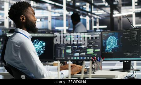 Programmer uses node tree software to identify equipment performance issues and data patterns. Stock Photo