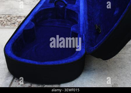 Close-up of an empty black violin case, with the insides being covered in blue velvet. México. Concept: violin case empty, musician, violin, music Stock Photo