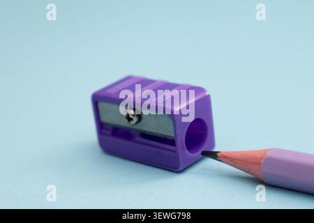 Colorful colored pencils arranged diagonally on blue background with copy space Stock Photo
