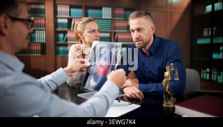 Legal Expert Reviews Hospital Records Closely To Support Patient Injury Claim Today. Stock Photo