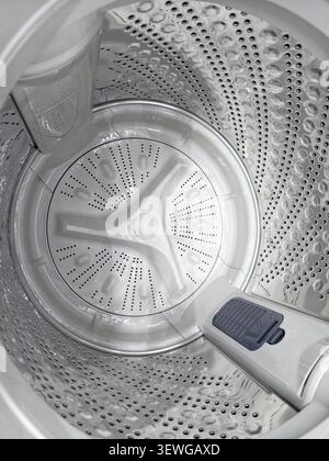 Inside top load washing machine with empty drum Stock Photo