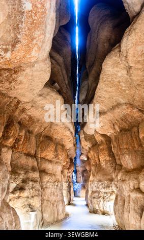 Dramatic view of the interior sandstone caves at Al Qarah Mountain, a natural geological landmark in the Al Ahsa oasis, Saudi Arabia Stock Photo