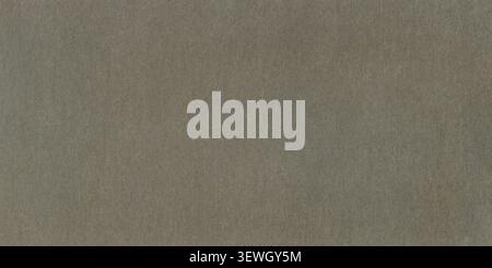 Grey surface of an old paper or cardboard, background, texture. Backdrop of gray, rough paper surface. Old, a little bit worn, shabby paper piece. Anc Stock Photo