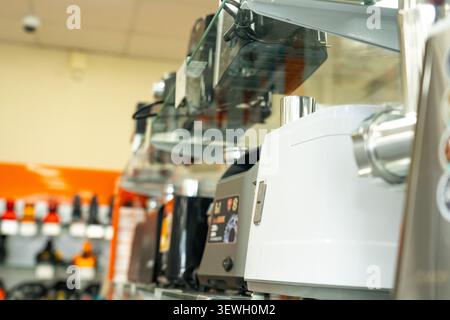 A Showcase of Modern Kitchen Appliances in a Retail Display, Featuring Various High-Tech Cooking Devices on Glass Shelves Stock Photo
